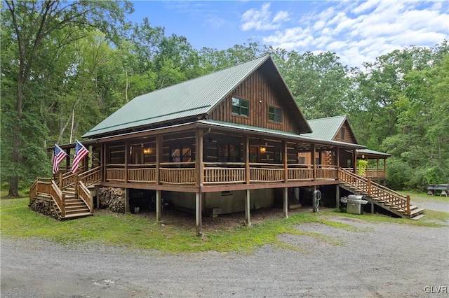 view of front facade with a wooden deck