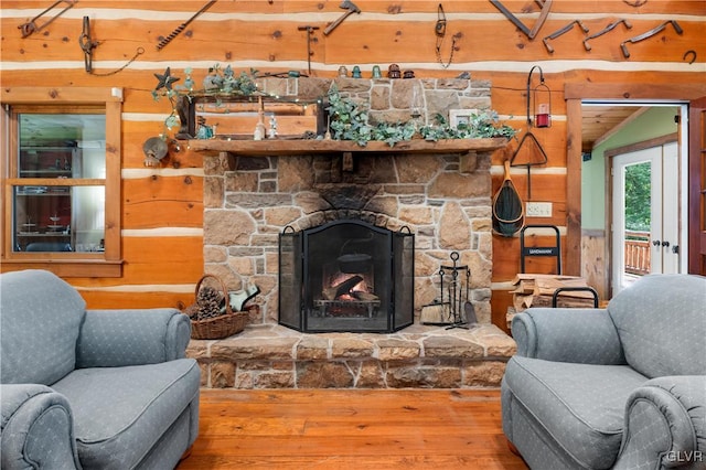 living room with hardwood / wood-style flooring and a fireplace