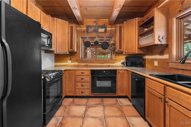 kitchen featuring black appliances, sink, wooden ceiling, and beamed ceiling