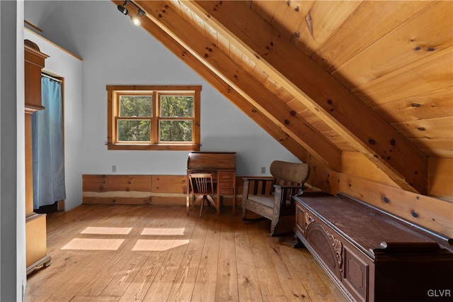 additional living space featuring lofted ceiling with beams, wood ceiling, and light hardwood / wood-style flooring