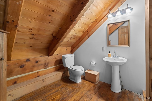 bathroom featuring vaulted ceiling with beams, wood ceiling, sink, wood-type flooring, and toilet