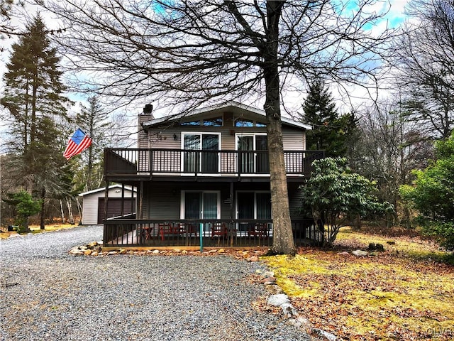 view of property with a garage and a deck