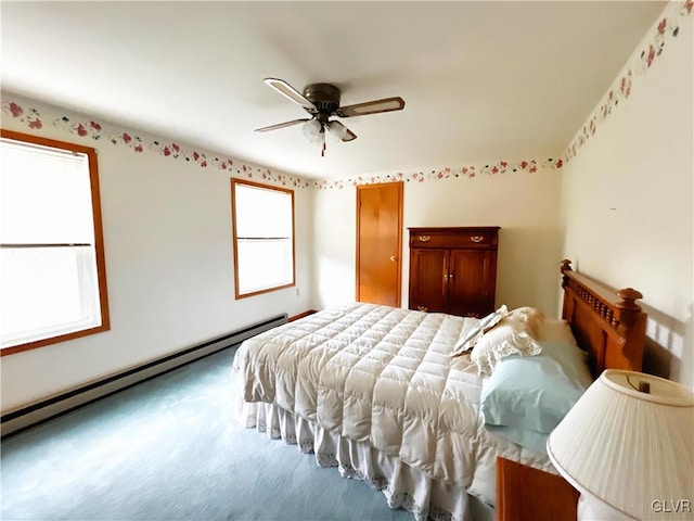 carpeted bedroom with ceiling fan, a baseboard radiator, and multiple windows