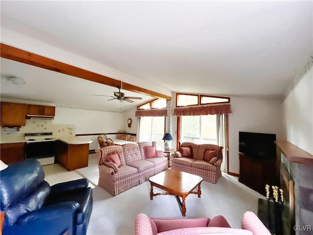 living room featuring ceiling fan and vaulted ceiling with beams