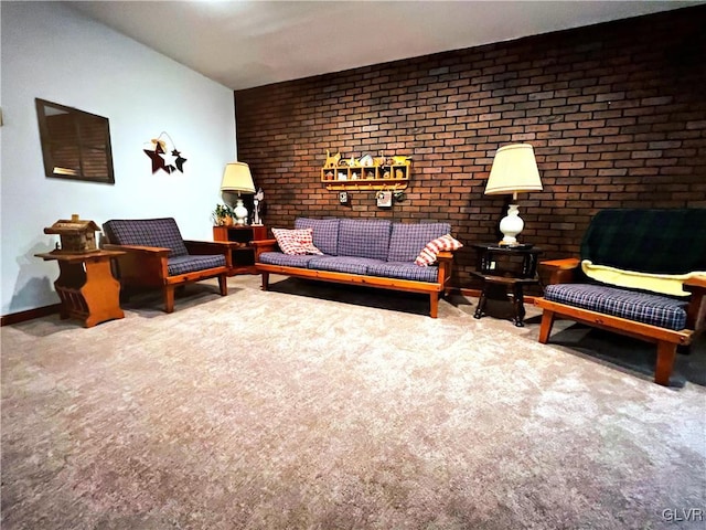 living room featuring brick wall and carpet floors