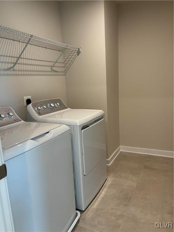 clothes washing area with washer and dryer