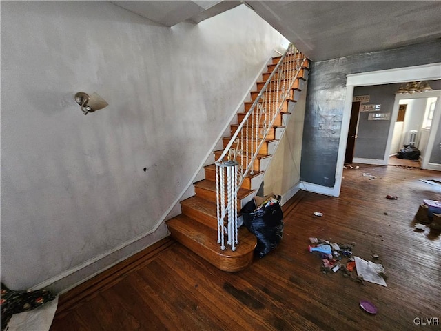 stairs with hardwood / wood-style floors