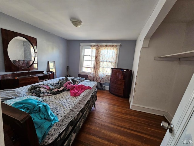 bedroom featuring dark hardwood / wood-style floors