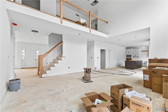 living room featuring a high ceiling