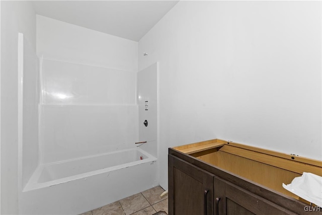 bathroom featuring tile patterned flooring and shower / bathing tub combination