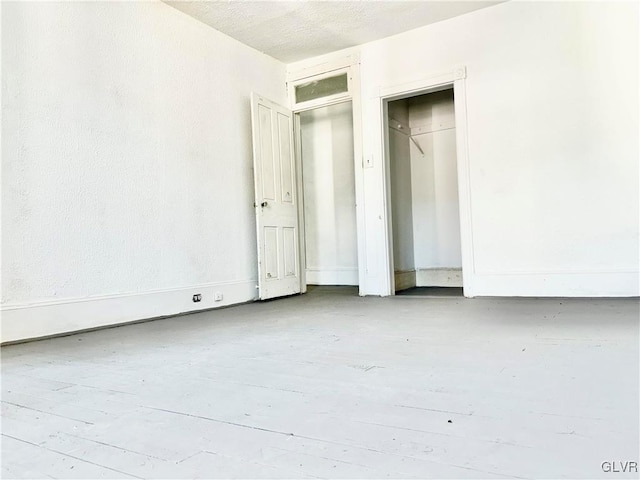 unfurnished bedroom with a textured ceiling