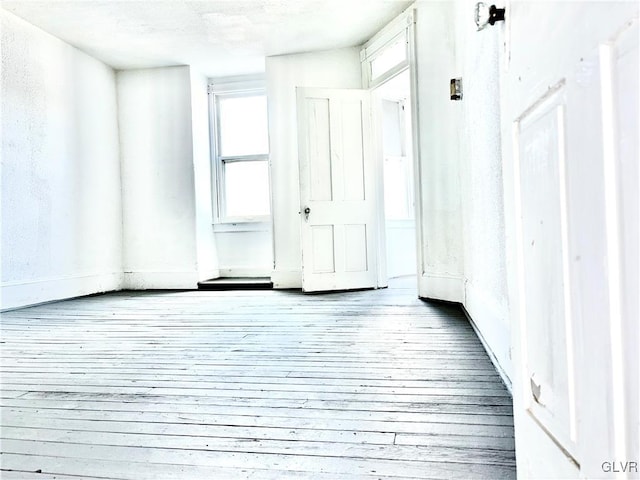 unfurnished room featuring light hardwood / wood-style floors