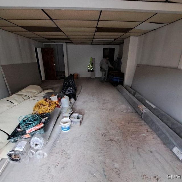 basement featuring a drop ceiling