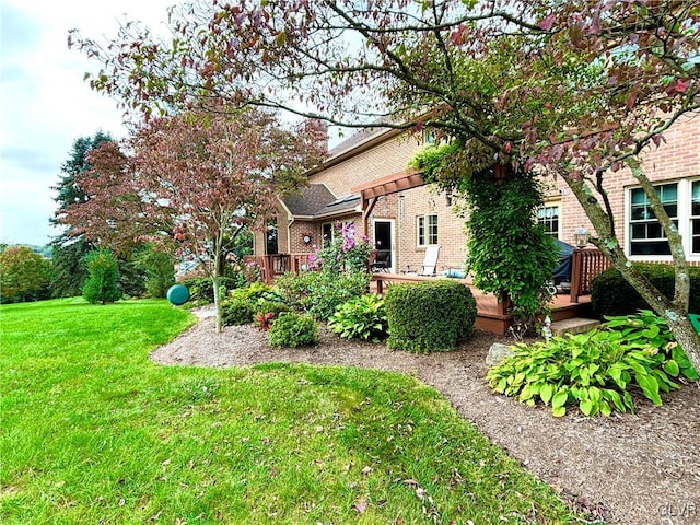 view of yard featuring a wooden deck