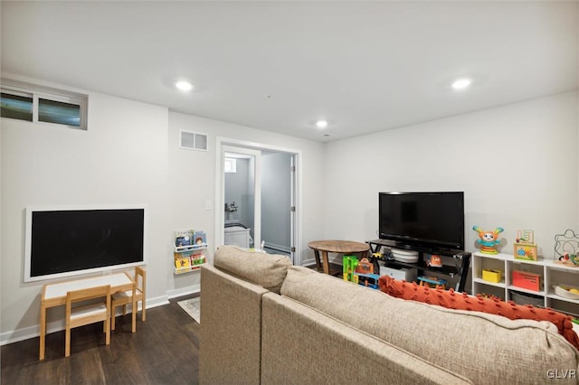 living room with dark hardwood / wood-style flooring