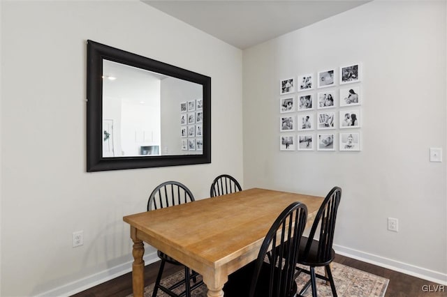 dining space featuring dark hardwood / wood-style floors