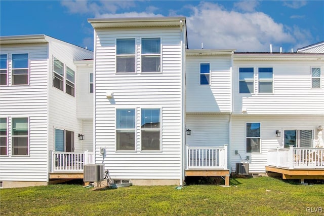 back of house featuring a yard, cooling unit, and a deck