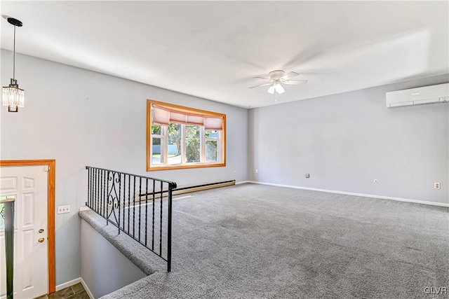 carpeted spare room featuring baseboard heating, a wall mounted air conditioner, and ceiling fan