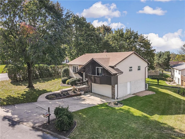 rear view of property featuring a yard