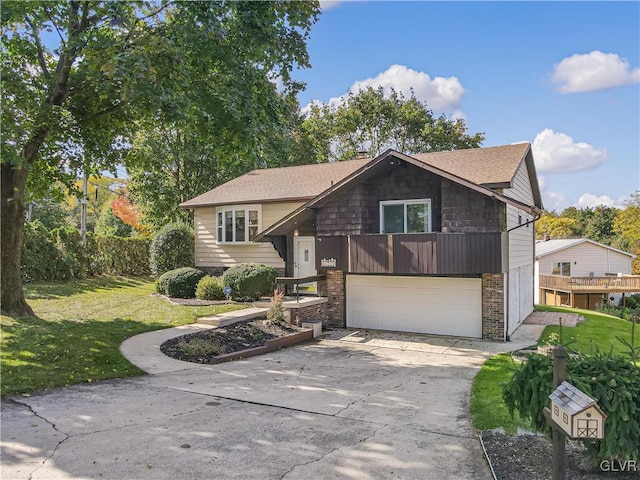 view of front of property featuring a front lawn and a garage