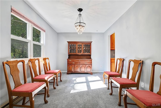 sitting room with light carpet and a chandelier