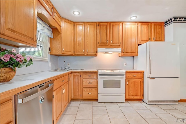 kitchen featuring sink, light tile patterned floors, and white appliances