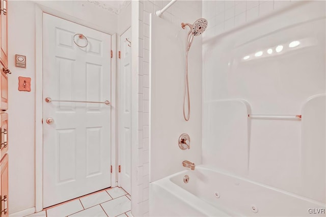 bathroom with tiled shower / bath and tile patterned floors