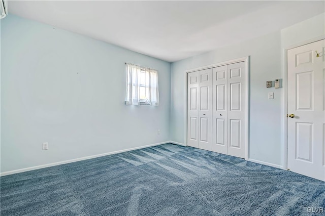 unfurnished bedroom with a closet and carpet floors