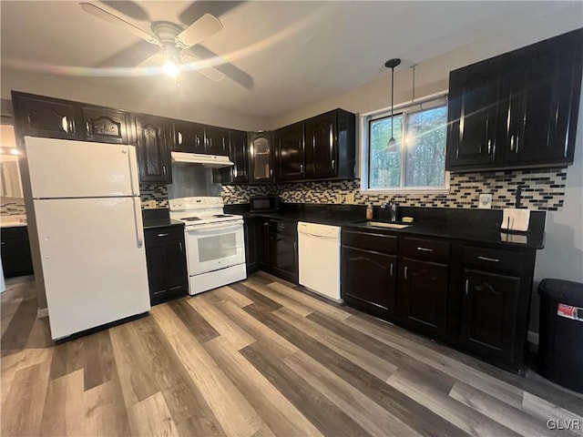 kitchen with decorative backsplash, ceiling fan, light hardwood / wood-style floors, sink, and white appliances