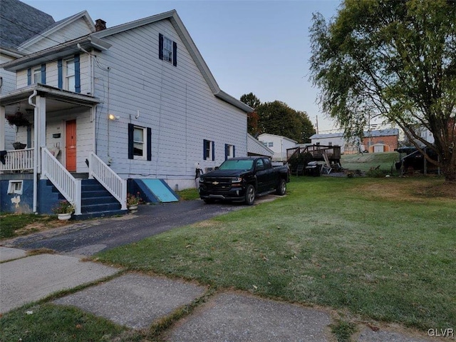 view of home's exterior with a lawn