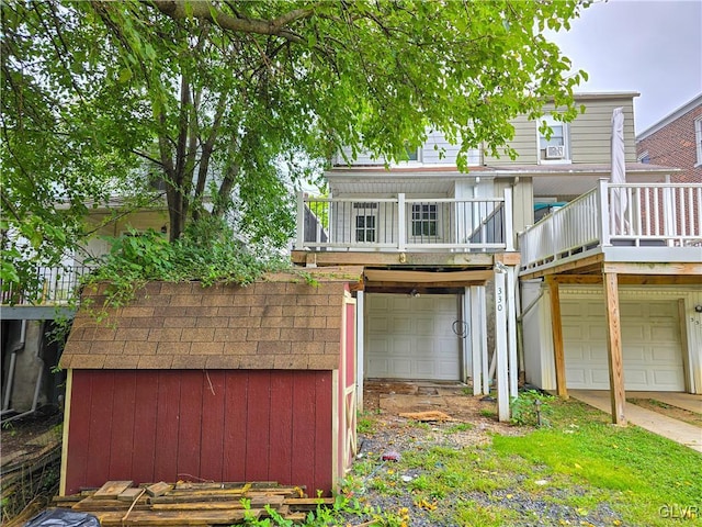 view of front facade with a balcony and a garage