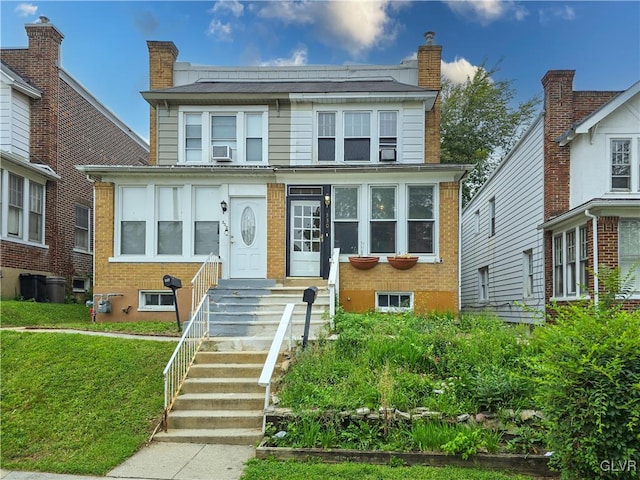 view of front of house featuring a front yard and cooling unit