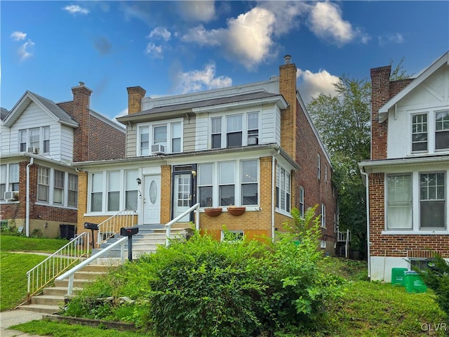 view of front of home featuring cooling unit