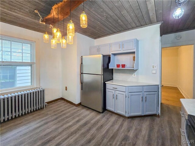 kitchen with radiator, stainless steel refrigerator, decorative light fixtures, and wooden ceiling