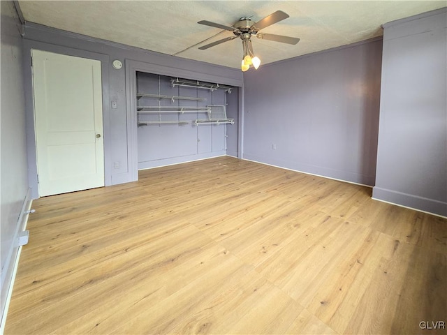 unfurnished bedroom featuring light hardwood / wood-style flooring and ceiling fan