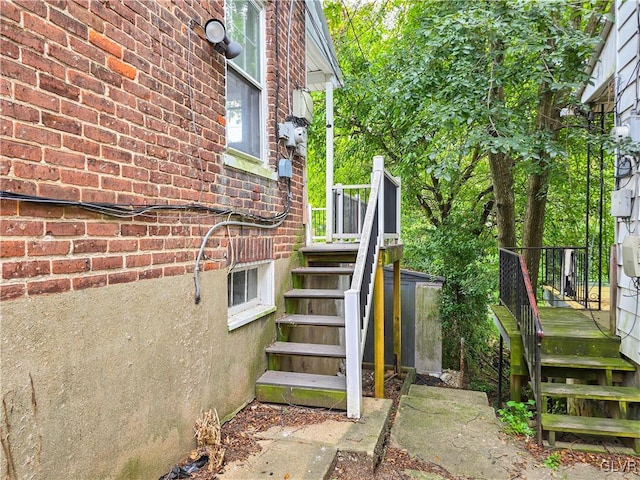 view of exterior entry with a wooden deck