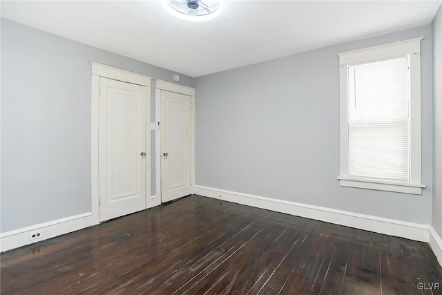 empty room with hardwood / wood-style flooring