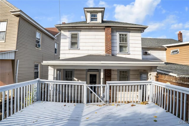 rear view of property with a deck