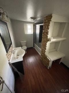 bathroom with vanity, hardwood / wood-style flooring, toilet, and walk in shower