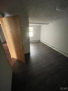 basement featuring dark hardwood / wood-style floors