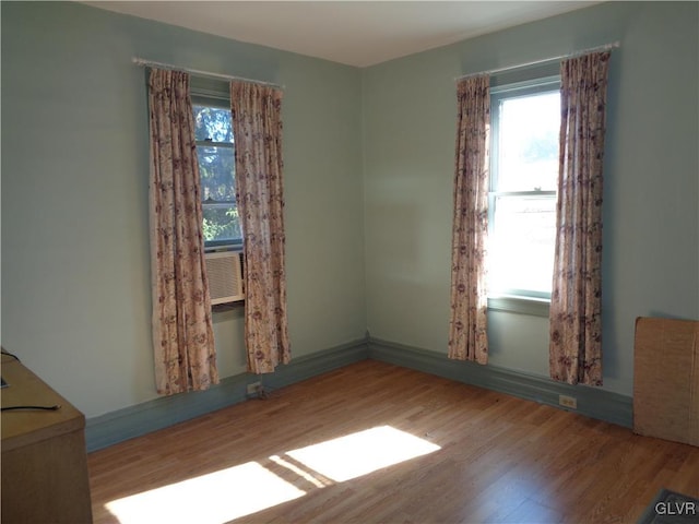 spare room with hardwood / wood-style floors