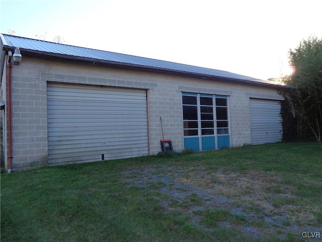 garage with a yard