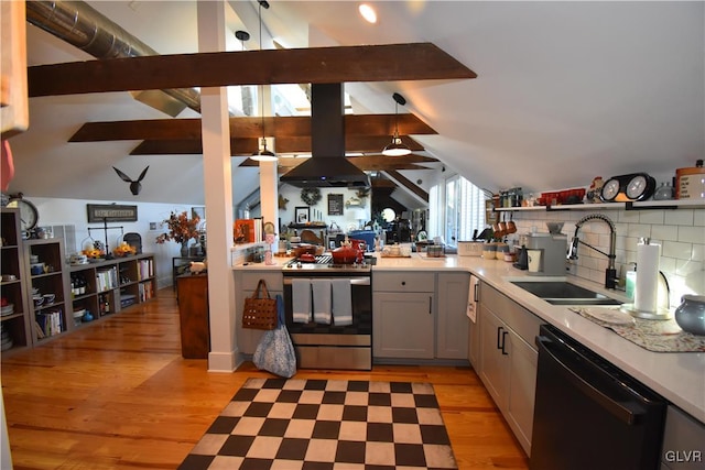 kitchen featuring dishwasher, sink, lofted ceiling with beams, light wood-type flooring, and stainless steel range oven