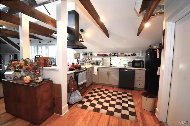 kitchen with black appliances, light wood-type flooring, white cabinetry, range hood, and beam ceiling