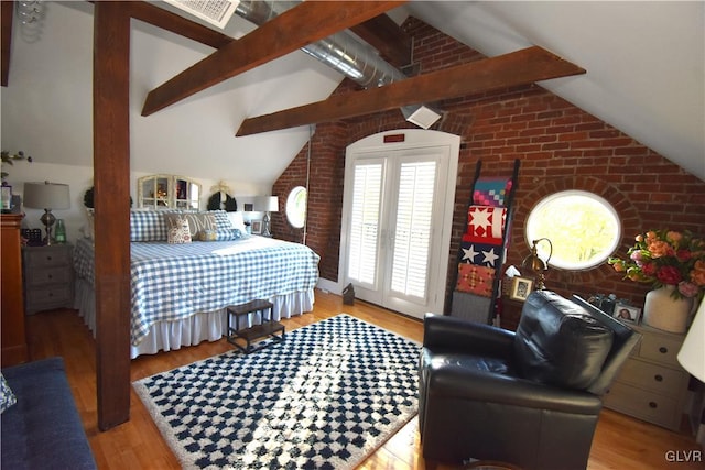 bedroom with vaulted ceiling with beams, light hardwood / wood-style flooring, french doors, and brick wall