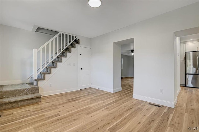 interior space featuring ceiling fan and light hardwood / wood-style flooring