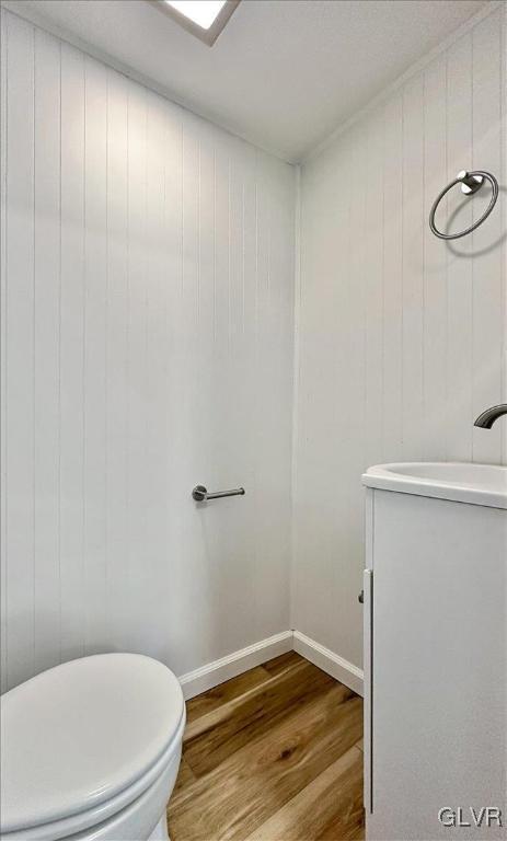 3331 Walnut St, Bethlehem Twp, PA 18020 - bathroom featuring wood finished floors, toilet, and baseboards