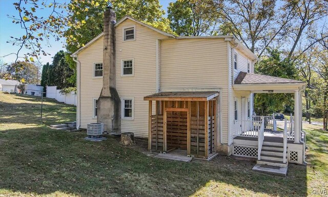 3331 Walnut St, Bethlehem Twp, PA 18020 - back of house featuring a yard, a chimney, and central AC unit