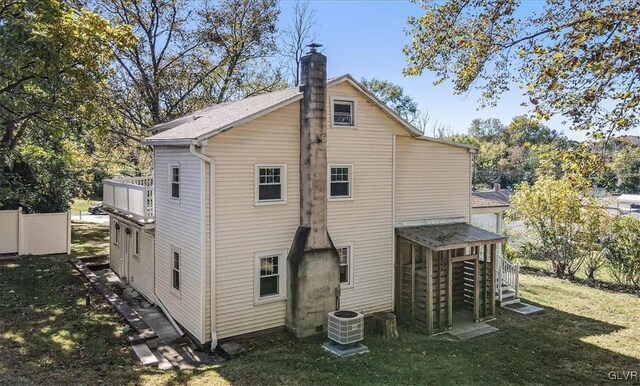 3331 Walnut St, Bethlehem Twp, PA 18020 - rear view of property with a chimney, a lawn, and cooling unit