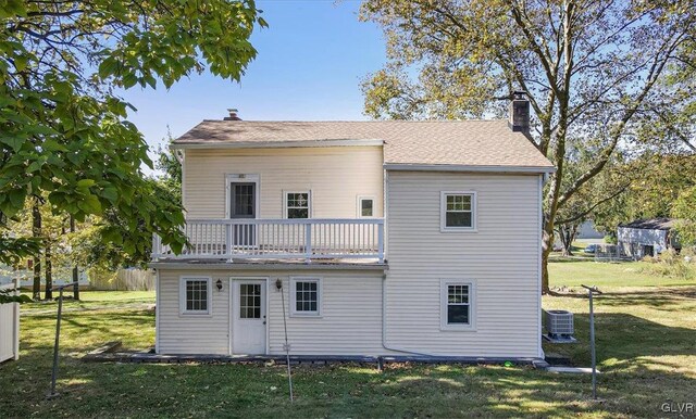 3331 Walnut St, Bethlehem Twp, PA 18020 - back of property featuring a chimney, cooling unit, a balcony, and a lawn